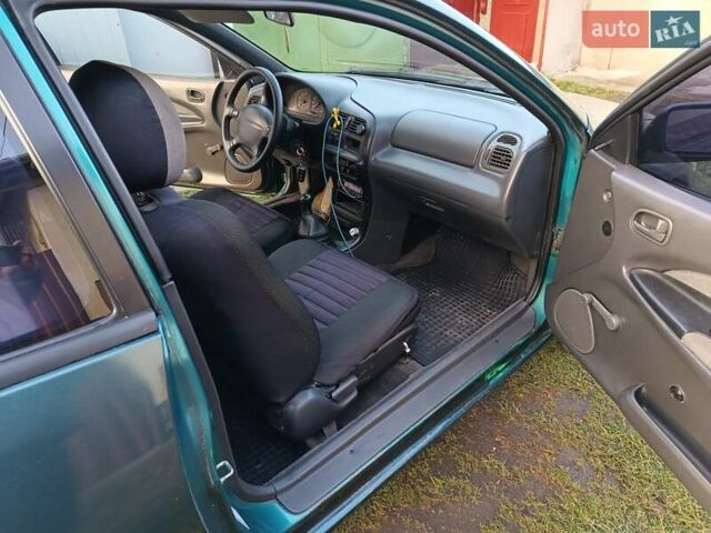 Зеленый Мазда 323, объемом двигателя 1.3 л и пробегом 330 тыс. км за 1700 $, фото 2 на Automoto.ua