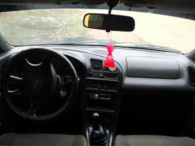 Зеленый Мазда 323, объемом двигателя 10 л и пробегом 100 тыс. км за 960 $, фото 4 на Automoto.ua