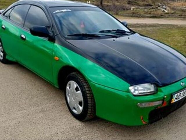 Зеленый Мазда 323, объемом двигателя 10 л и пробегом 100 тыс. км за 960 $, фото 2 на Automoto.ua