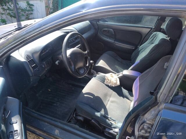 Зеленый Мазда 323, объемом двигателя 2 л и пробегом 250 тыс. км за 1440 $, фото 6 на Automoto.ua