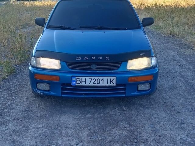 Зеленый Мазда 323, объемом двигателя 1.5 л и пробегом 300 тыс. км за 1903 $, фото 3 на Automoto.ua