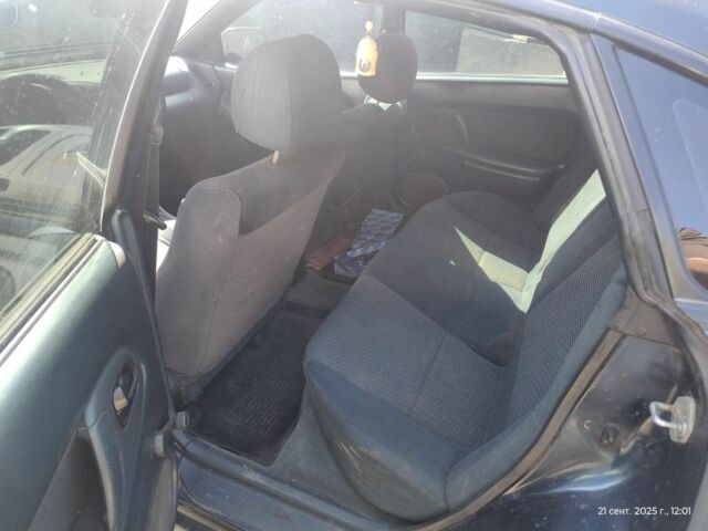 Зеленый Мазда 323, объемом двигателя 2 л и пробегом 250 тыс. км за 1440 $, фото 5 на Automoto.ua