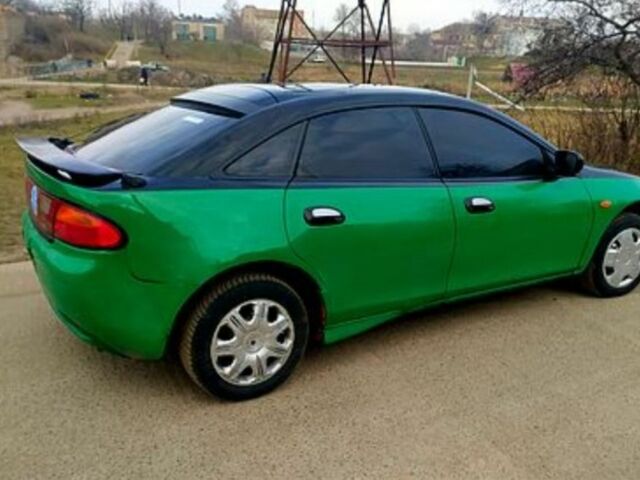 Зеленый Мазда 323, объемом двигателя 10 л и пробегом 100 тыс. км за 960 $, фото 3 на Automoto.ua