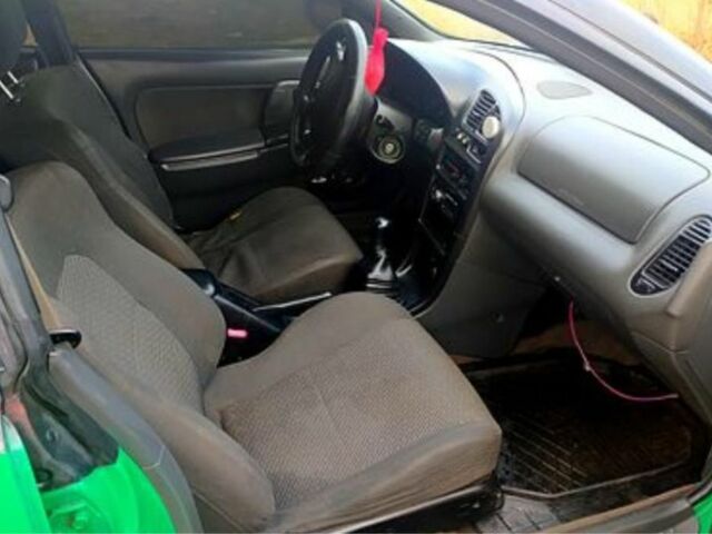 Зеленый Мазда 323, объемом двигателя 10 л и пробегом 100 тыс. км за 960 $, фото 7 на Automoto.ua