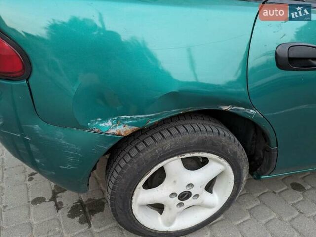 Зеленый Мазда 323, объемом двигателя 1.49 л и пробегом 290 тыс. км за 1799 $, фото 10 на Automoto.ua