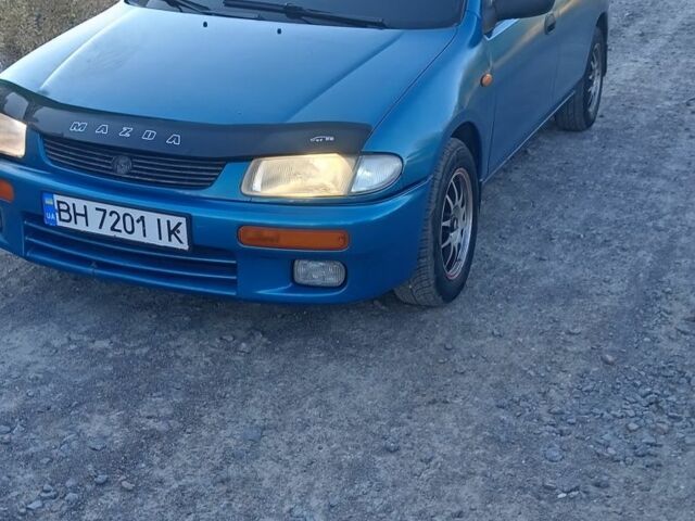 Зеленый Мазда 323, объемом двигателя 1.5 л и пробегом 300 тыс. км за 1903 $, фото 1 на Automoto.ua