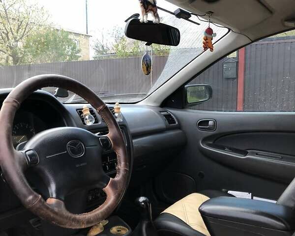 Зеленый Мазда 323, объемом двигателя 1.5 л и пробегом 290 тыс. км за 1500 $, фото 25 на Automoto.ua