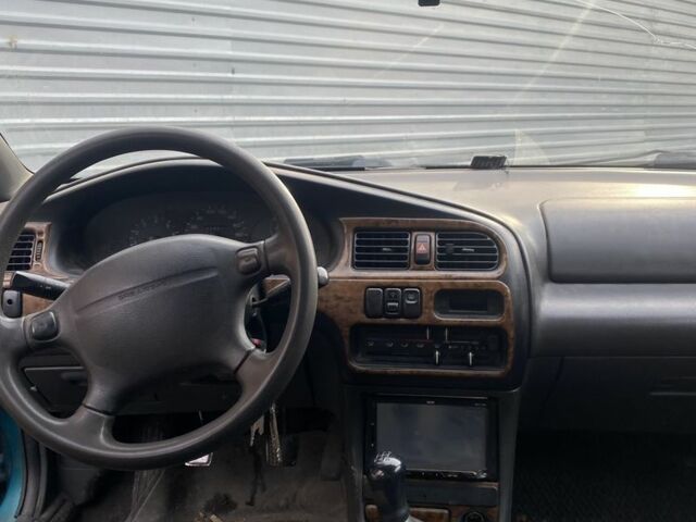 Зеленый Мазда 323, объемом двигателя 1.5 л и пробегом 424 тыс. км за 1500 $, фото 2 на Automoto.ua