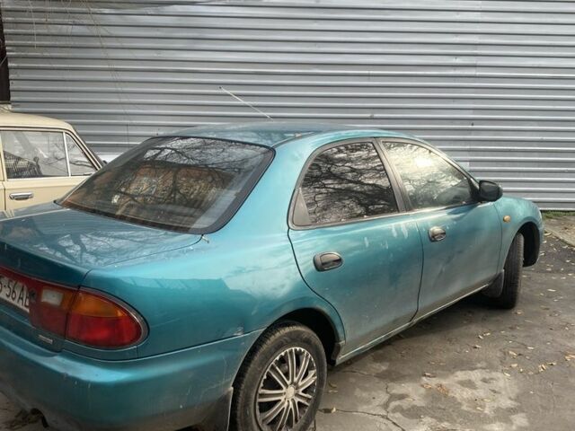 Зеленый Мазда 323, объемом двигателя 1.5 л и пробегом 424 тыс. км за 1500 $, фото 6 на Automoto.ua