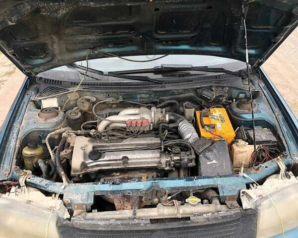 Зеленый Мазда 323, объемом двигателя 1.5 л и пробегом 290 тыс. км за 1500 $, фото 14 на Automoto.ua