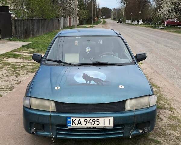 Зеленый Мазда 323, объемом двигателя 1.5 л и пробегом 290 тыс. км за 1500 $, фото 27 на Automoto.ua