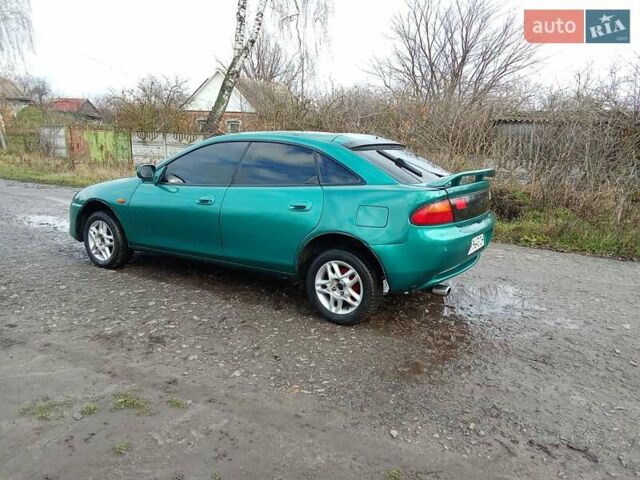 Зелений Мазда 323, об'ємом двигуна 1.49 л та пробігом 350 тис. км за 2100 $, фото 9 на Automoto.ua