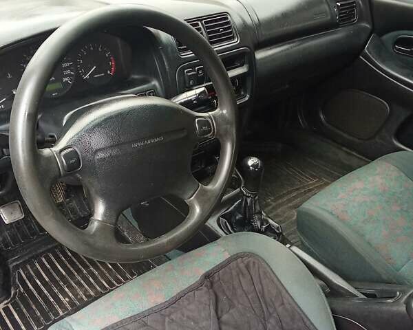 Зелений Мазда 323, об'ємом двигуна 1.49 л та пробігом 350 тис. км за 2100 $, фото 11 на Automoto.ua