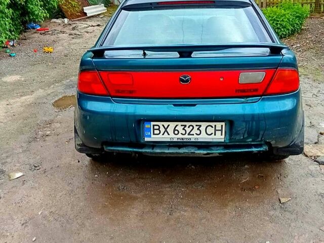 Зеленый Мазда 323, объемом двигателя 1.5 л и пробегом 161 тыс. км за 2100 $, фото 1 на Automoto.ua