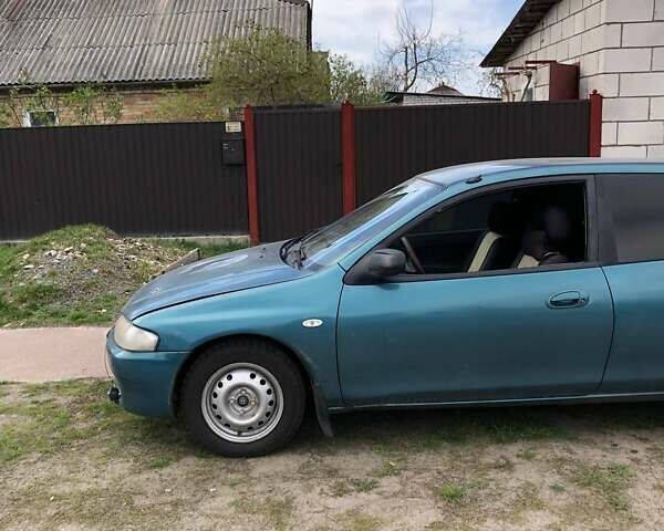 Зеленый Мазда 323, объемом двигателя 1.5 л и пробегом 290 тыс. км за 1500 $, фото 28 на Automoto.ua