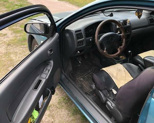 Зеленый Мазда 323, объемом двигателя 1.5 л и пробегом 290 тыс. км за 1500 $, фото 12 на Automoto.ua