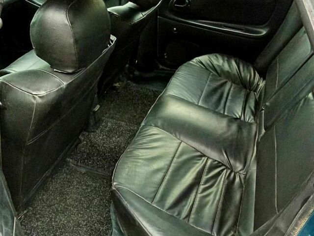 Зеленый Мазда 323, объемом двигателя 1.5 л и пробегом 161 тыс. км за 2100 $, фото 4 на Automoto.ua