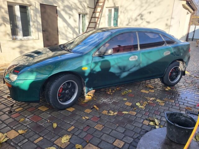 Зеленый Мазда 323, объемом двигателя 1.5 л и пробегом 270 тыс. км за 2199 $, фото 2 на Automoto.ua