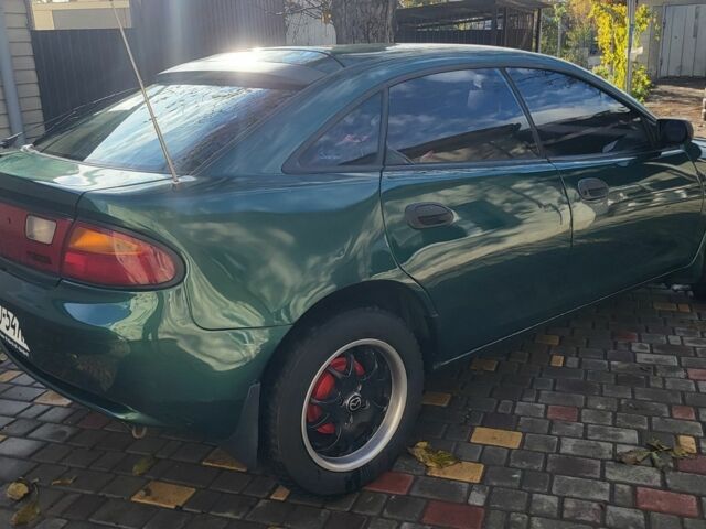 Зеленый Мазда 323, объемом двигателя 1.5 л и пробегом 270 тыс. км за 2199 $, фото 4 на Automoto.ua