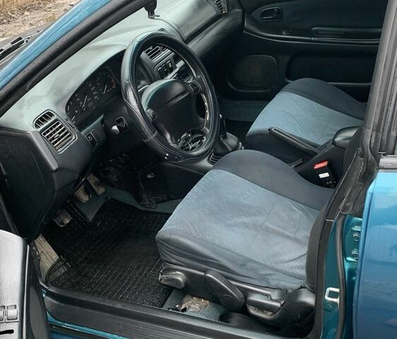 Зелений Мазда 323, об'ємом двигуна 1.5 л та пробігом 270 тис. км за 2000 $, фото 4 на Automoto.ua