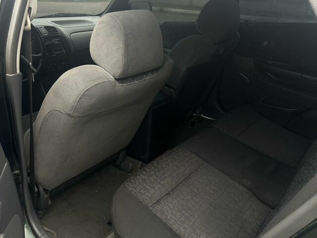 Зеленый Мазда 323, объемом двигателя 1.5 л и пробегом 400 тыс. км за 1500 $, фото 5 на Automoto.ua