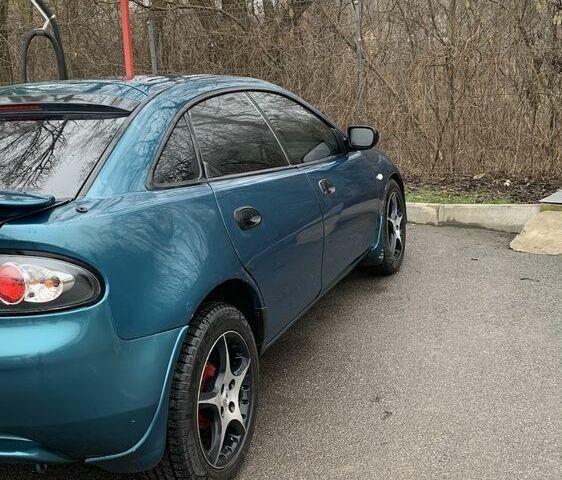 Зелений Мазда 323, об'ємом двигуна 1.5 л та пробігом 270 тис. км за 2000 $, фото 6 на Automoto.ua