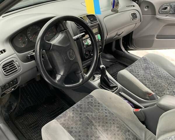 Зелений Мазда 323, об'ємом двигуна 1.5 л та пробігом 240 тис. км за 3600 $, фото 7 на Automoto.ua