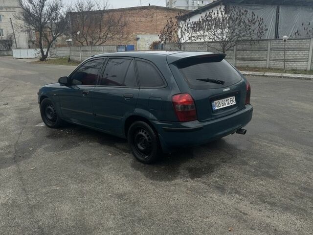 Зеленый Мазда 323, объемом двигателя 1.5 л и пробегом 400 тыс. км за 1500 $, фото 3 на Automoto.ua