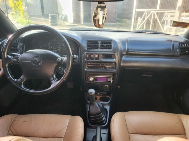 Зеленый Мазда 323, объемом двигателя 1.5 л и пробегом 270 тыс. км за 2199 $, фото 6 на Automoto.ua