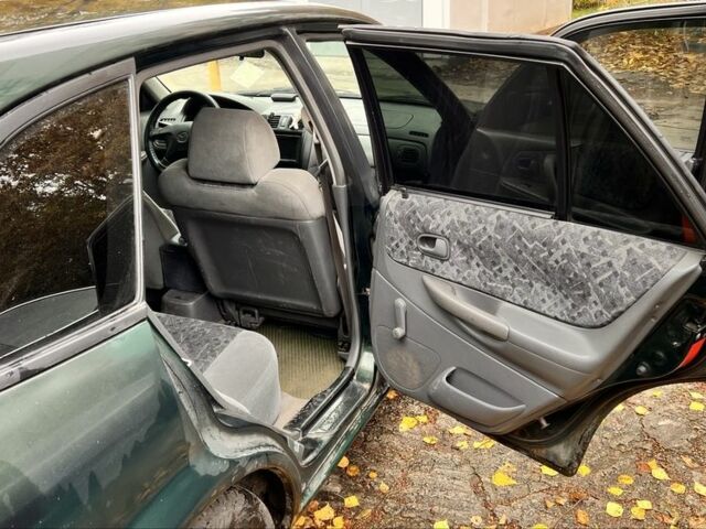 Мазда 323 1999 в Киеве на Automoto.ua Зеленый Мазда 323, объемом двигателя 1.5 л и пробегом 350 тыс. км за 2400 $, фото 9 на Automoto.ua