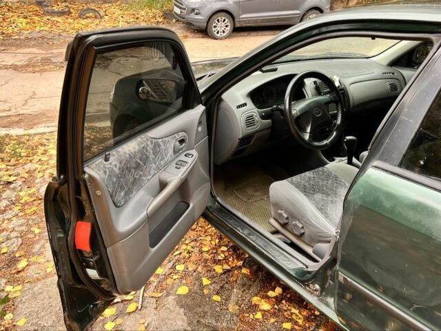 Мазда 323 1999 в Киеве на Automoto.ua Зеленый Мазда 323, объемом двигателя 1.5 л и пробегом 350 тыс. км за 2400 $, фото 11 на Automoto.ua
