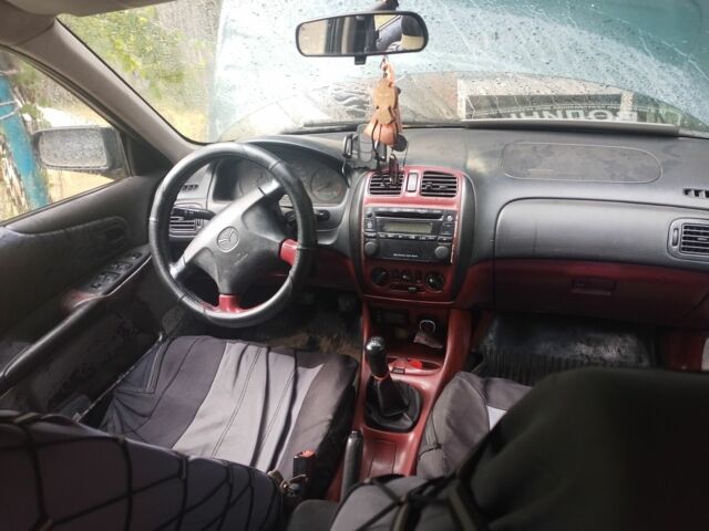 Зеленый Мазда 323, объемом двигателя 2 л и пробегом 415 тыс. км за 560 $, фото 7 на Automoto.ua