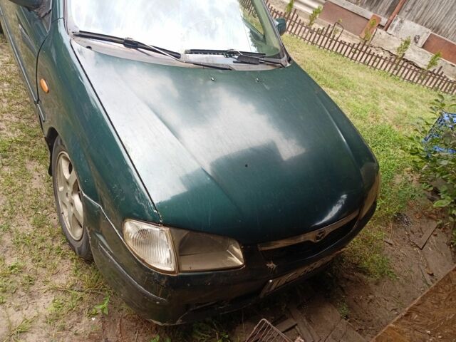 Зеленый Мазда 323, объемом двигателя 2 л и пробегом 415 тыс. км за 560 $, фото 5 на Automoto.ua