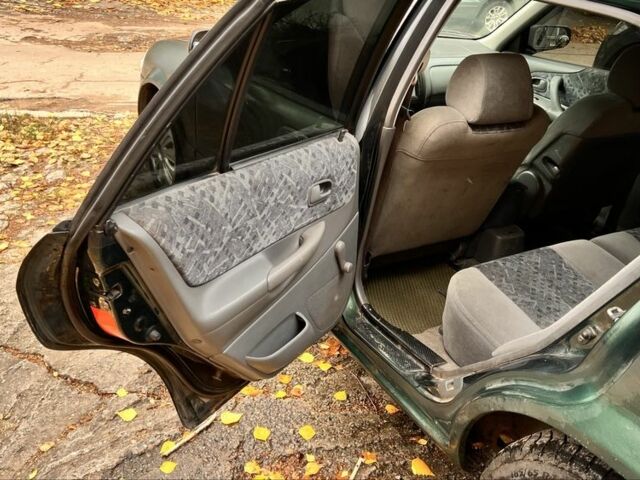Мазда 323 1999 в Киеве на Automoto.ua Зеленый Мазда 323, объемом двигателя 1.5 л и пробегом 350 тыс. км за 2400 $, фото 10 на Automoto.ua