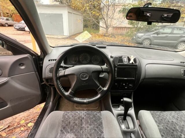 Мазда 323 1999 в Киеве на Automoto.ua Зеленый Мазда 323, объемом двигателя 1.5 л и пробегом 350 тыс. км за 2400 $, фото 14 на Automoto.ua