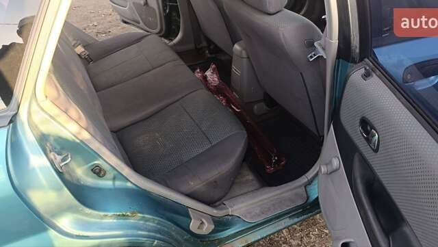 Зеленый Мазда 323, объемом двигателя 1.6 л и пробегом 288 тыс. км за 2000 $, фото 3 на Automoto.ua