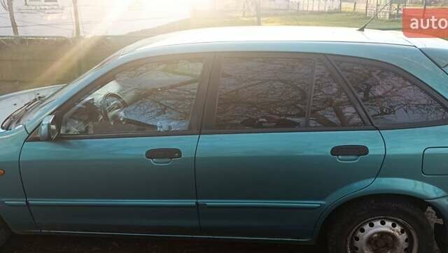 Зеленый Мазда 323, объемом двигателя 1.6 л и пробегом 288 тыс. км за 2000 $, фото 6 на Automoto.ua