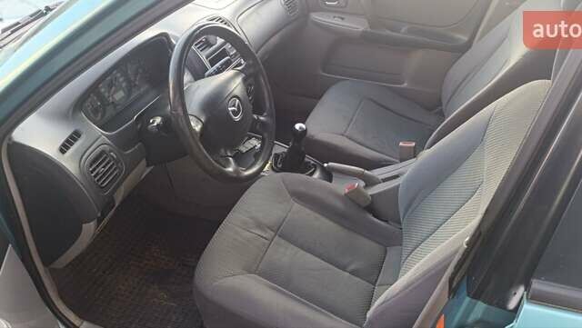 Зеленый Мазда 323, объемом двигателя 1.6 л и пробегом 288 тыс. км за 2000 $, фото 4 на Automoto.ua