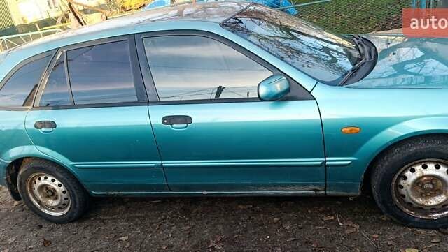 Зеленый Мазда 323, объемом двигателя 1.6 л и пробегом 288 тыс. км за 2000 $, фото 8 на Automoto.ua