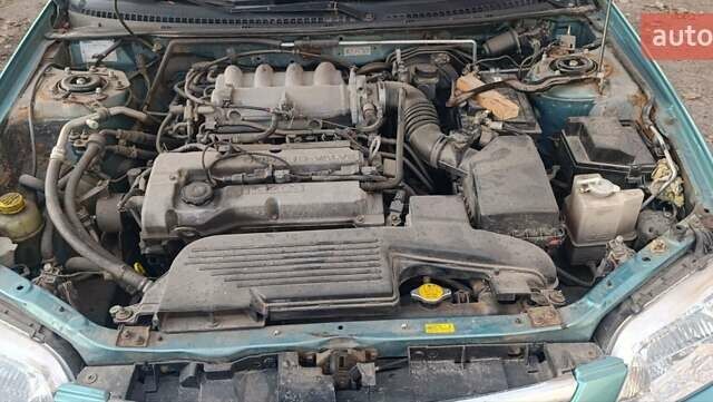 Зеленый Мазда 323, объемом двигателя 1.6 л и пробегом 288 тыс. км за 2000 $, фото 5 на Automoto.ua