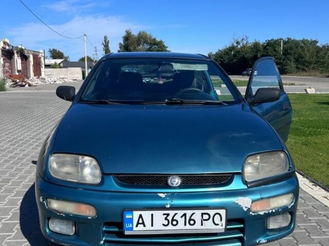 Зеленый Мазда 323, объемом двигателя 1.5 л и пробегом 317 тыс. км за 1300 $, фото 7 на Automoto.ua