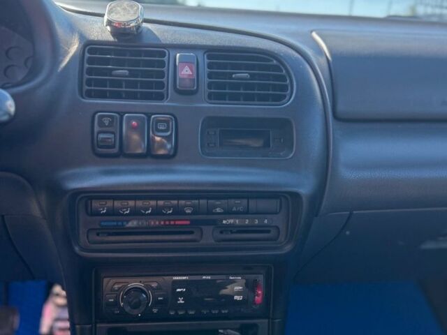 Зеленый Мазда 323, объемом двигателя 1.5 л и пробегом 317 тыс. км за 1300 $, фото 3 на Automoto.ua