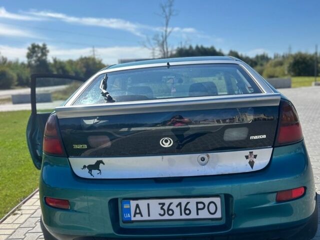 Зеленый Мазда 323, объемом двигателя 1.5 л и пробегом 317 тыс. км за 1300 $, фото 11 на Automoto.ua