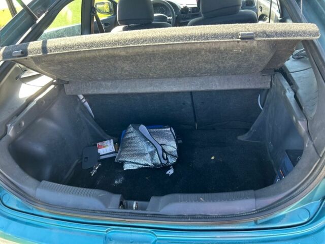 Зеленый Мазда 323, объемом двигателя 1.5 л и пробегом 317 тыс. км за 1300 $, фото 1 на Automoto.ua