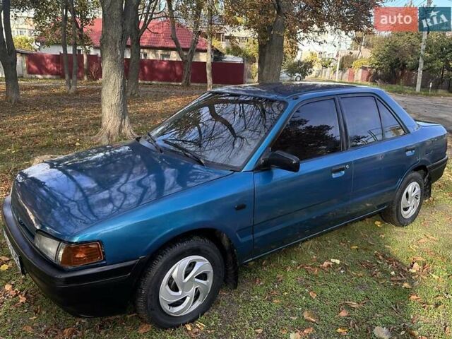 Зеленый Мазда 323, объемом двигателя 1.6 л и пробегом 200 тыс. км за 1000 $, фото 1 на Automoto.ua