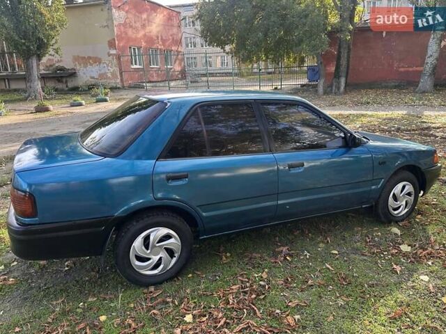 Зеленый Мазда 323, объемом двигателя 1.6 л и пробегом 200 тыс. км за 1000 $, фото 2 на Automoto.ua