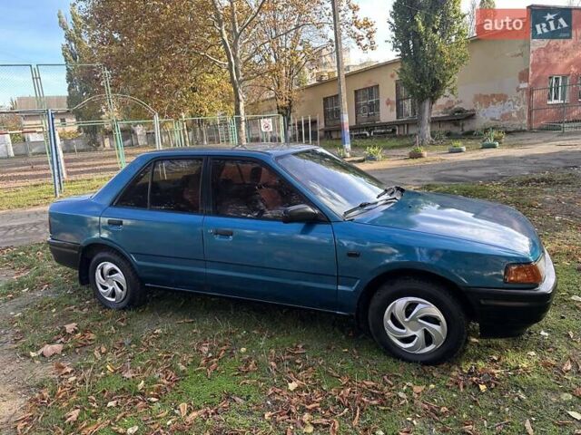 Зеленый Мазда 323, объемом двигателя 1.6 л и пробегом 200 тыс. км за 1000 $, фото 11 на Automoto.ua