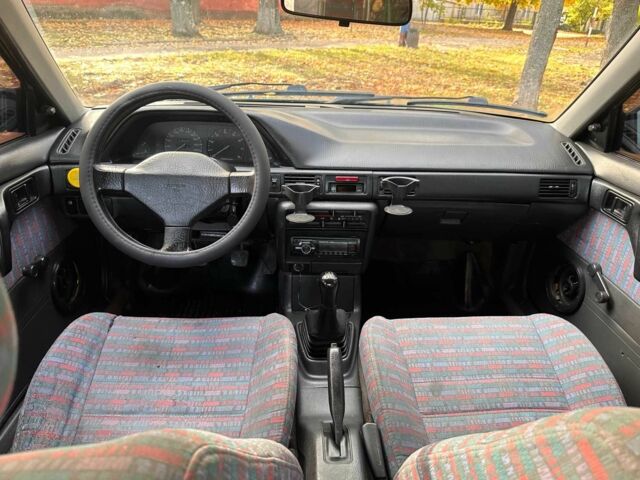 Зелений Мазда 323, об'ємом двигуна 1.3 л та пробігом 200 тис. км за 1250 $, фото 6 на Automoto.ua