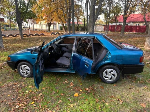 Зелений Мазда 323, об'ємом двигуна 1.3 л та пробігом 200 тис. км за 1250 $, фото 2 на Automoto.ua