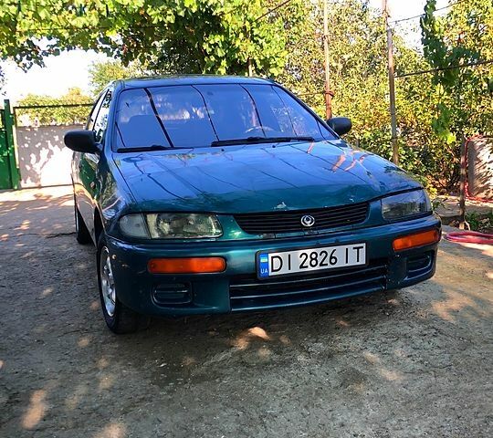 Зеленый Мазда 323, объемом двигателя 1.3 л и пробегом 211 тыс. км за 2700 $, фото 2 на Automoto.ua